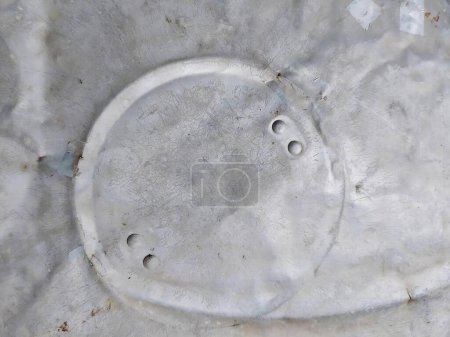 Photo for A photography of a toilet seat with holes in it, nematode worm hole in concrete with holes in it. - Royalty Free Image