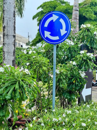 Photo for A blue sign with a white arrow pointing to the left. - Royalty Free Image