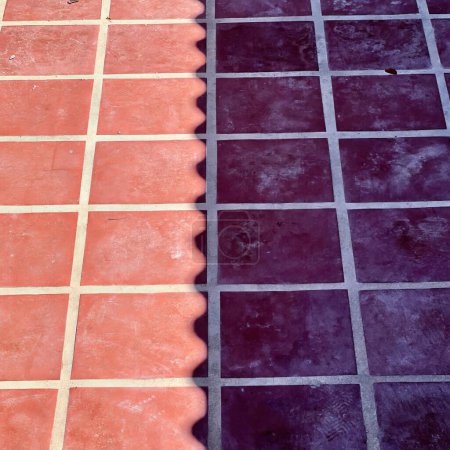 Photo for The tiles are a bit darker than the rest of the floor. - Royalty Free Image