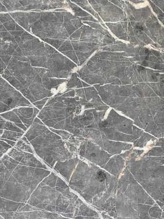 a photography of a black and white marble floor with a black and white pattern.