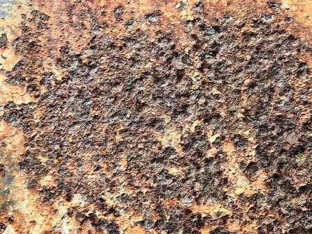 a photography of a rusted metal surface with a lot of rust.