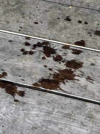 a photography of a dirty floor with a wooden floor and a wooden floor.