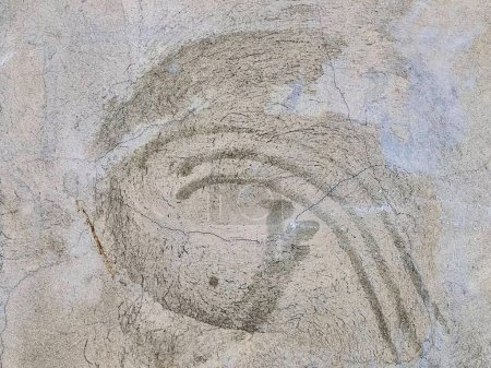 Fotografie einer Nahaufnahme einer Steinmauer mit kreisförmigem Design.