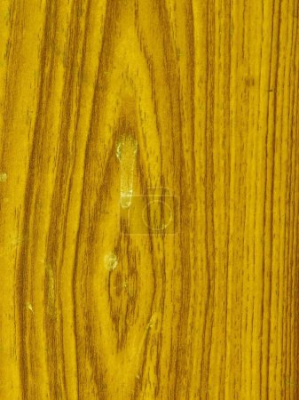 una fotografía de un primer plano de una superficie de madera granulada.