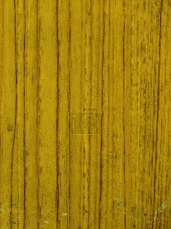 a photography of a wooden surface with a yellow paint.