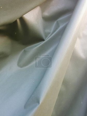 a photography of a close up of a white cloth with a toothbrush.