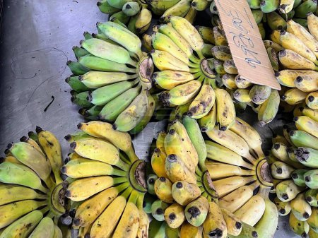 Photo for A photography of a bunch of bananas with a price tag on them. - Royalty Free Image