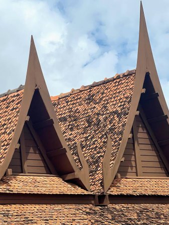 a photography of a brown roof with three triangular shaped roofing.