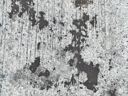 a photography of a dirty wall with some paint on it.