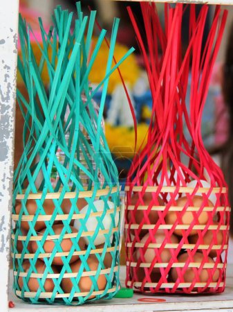 a photography of a couple of baskets with eggs in them.