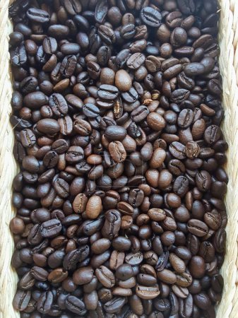 a photography of a basket filled with coffee beans on top of a table.