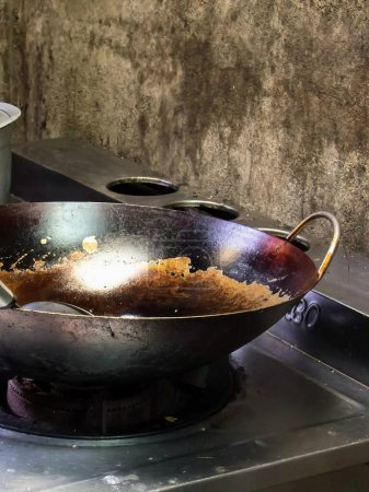 a photography of a wok with a lot of food in it.