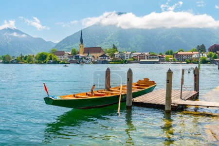 A summer day on Lake Tegernsee, Bavaria. Wooden boat at the pier