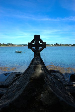 Photo for Celtic cross on the bay of the Etel river (Ria d'Etel) Brittany, Morbihan - Royalty Free Image