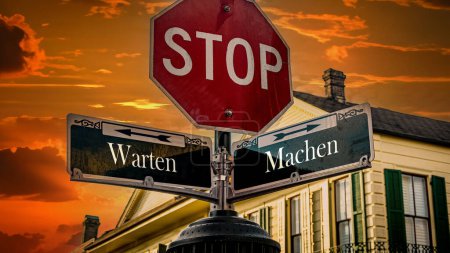 Foto de Una imagen con una señal apuntando en dos direcciones diferentes en alemán. Una dirección es hacer, la otra es esperar. - Imagen libre de derechos