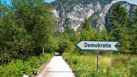 Photo for The picture shows a signpost and a sign that points in the direction of democracy in german. - Royalty Free Image
