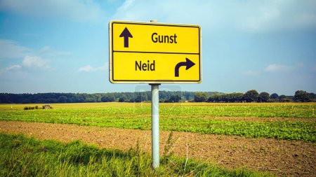 An image with a signpost pointing in two different directions in German. One direction points to favour, the other points to envy.