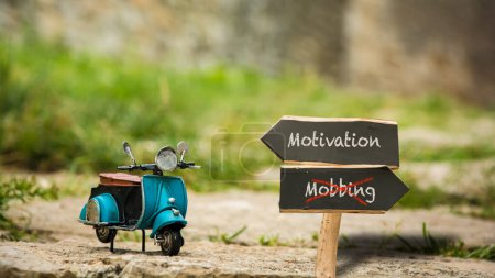 Ein Bild mit einem Wegweiser, der in zwei verschiedene Richtungen zeigt. Eine Richtung weist auf Motivation, die andere auf Mobbing.