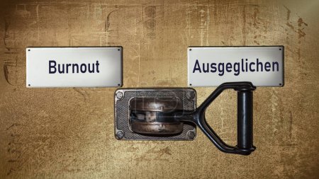 Una imagen con una señal apuntando en dos direcciones diferentes en alemán. Una dirección apunta a Equilibrado, la otra apunta a Burnout