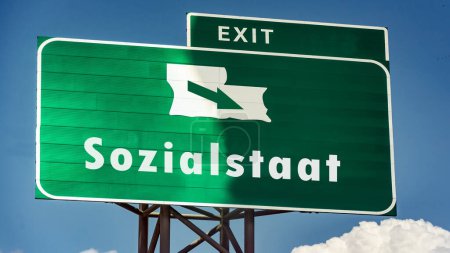Una imagen con una señal en alemán apuntando en la dirección del estado del bienestar.