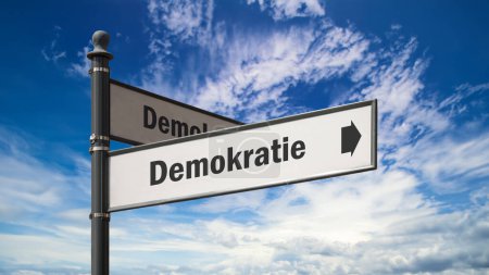 the picture shows a signpost and a sign that points in the direction of democracy in german.