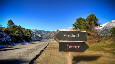 An image with a signpost pointing in two different directions in German. One direction points to freedom, the other points to terror.