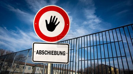 An image with a signpost pointing in two different directions in German. One direction points to asylum, the other points to deportation.