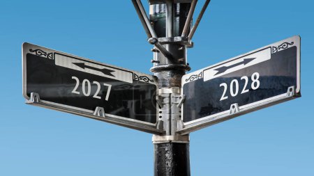An image with a signpost pointing in two different directions in German. One direction points to 2027, the other points to 2028.