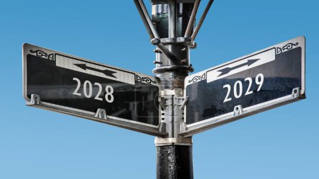 An image with a signpost pointing in two different directions in German. One direction points to 2029 the other points to 2028.