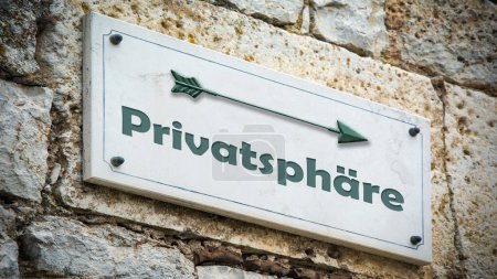 Photo for An image with a signpost in German pointing in the direction of privacy. - Royalty Free Image