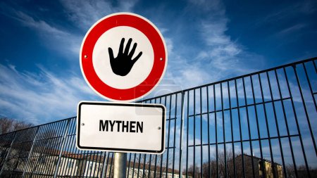 Una imagen con una señal apuntando en dos direcciones diferentes en alemán. Una dirección apunta a los hechos, la otra apunta a los mitos.