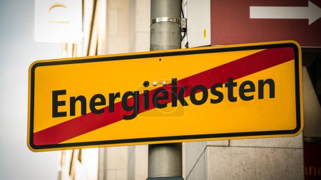 An image with a signpost pointing in two different directions in German. One direction points to efficiency, the other points to energy costs.