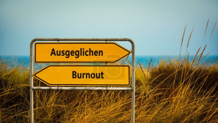 Une image avec un panneau pointant dans deux directions différentes en allemand. Une direction indique Équilibré, l'autre indique Épuisement