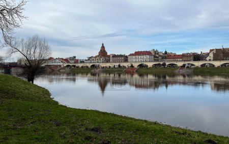 Poland, Gorzow Wielkopolski - 18 February 2024: View of the Warta River. Warta River flood. Flooded banks and embankment. Bildings.