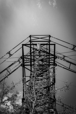 Metal support of a high-voltage power line black and white photo