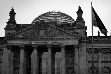 Photo for The dome of the Bundestag (Reichstag) building with the flag of Germany. Architectural monument. Historical building of Germany - Royalty Free Image