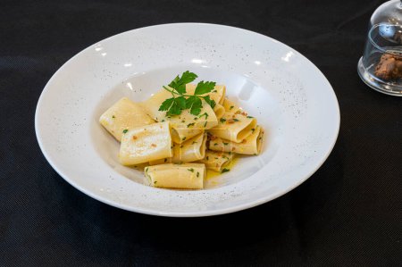 Freshly cooked paccheri pasta with grated bottarga
