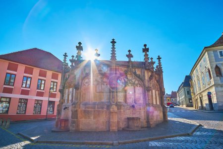 Photo for The sun rays on the medieval stone Kamenna Kasna (Stone Fountain), Kutna Hora, Czech Republic - Royalty Free Image