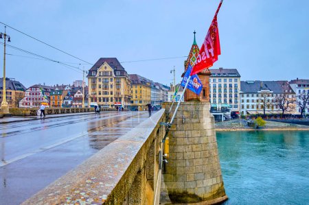Photo for BASEL, SWITZERLAND - APRIL 1, 2022: Stone Mittlere Brucke connects Altstadt Kleinbasel with Basel-Stadt districts, on April 1 in Basel, Switzerland - Royalty Free Image