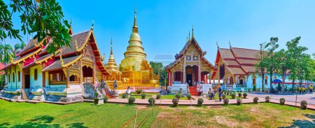 Téléchargez les photos : Panorama of green lawn, medieval shrines (Ubosot and Viharns) and golden chedi of Wat Phra Singh, Chiang Mai, Thailand - en image libre de droit