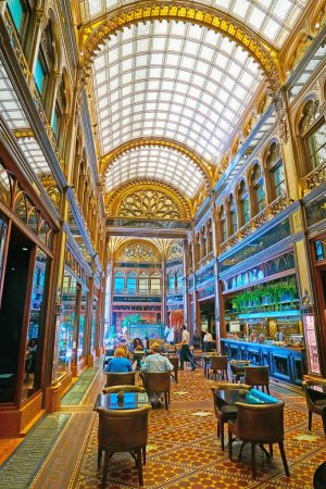 Photo for BUDAPEST, HUNGARY - FEB 22, 2022: The beautiful interior of the luxury restaurant in Paris Court (Brudern House) with stained-glass vault and carved wood, on Feb 22 in Budapest - Royalty Free Image