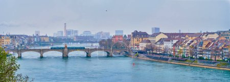 Photo for Panorama of Basel cityscape with historical riverside houses on bank of Rhine river and Mittlere Brucke bridge, Switzerland - Royalty Free Image