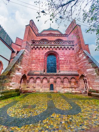 Foto de The red stone apse of Basel Minster Cathedral with large supperts and medieval foundation on the pavement, Switzerland - Imagen libre de derechos
