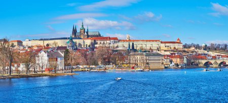 Panorama of Vltava River on a sunny day with a view on St Vitus Cathedral, Prague Castle and housing of Lesser Quarter, Prague, Czech Republic