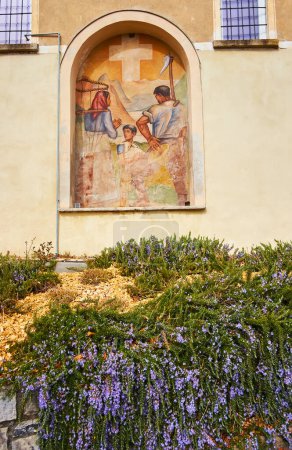 Photo for BRE, SWITZERLAND - MARCH 16, 2023: The vintage fresco with a Swiss family of the villagers in niche of the wall of old house in Bre village, Lugano, Switzerland - Royalty Free Image