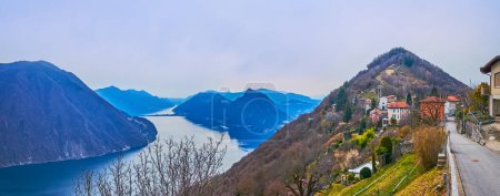 Photo for Lake Lugano, Monte San Salvatore, Melide Causeway, Monte Bre peak from the viewpoint on Bre village street, Ticino, Switzerland - Royalty Free Image
