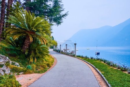 Photo for The lakeside path in Park Villa Heleneum on Lake Lugano, Lugano, Switzerland - Royalty Free Image