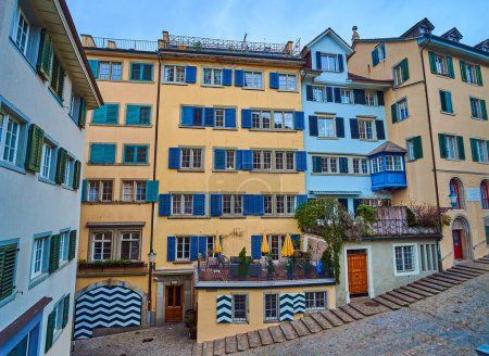 The scenic historic residential houses on Romergasse street next to Grossmunster, Zurich, Switzerland