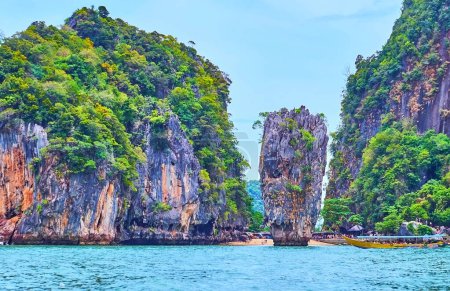 The scenic coast and cliffs of James Bond Island and Ko Ta Pu rock formation, view from the sea, Phang Nga Bay, Thailand