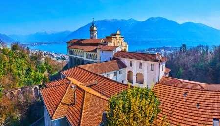 Panorama of historic Madonna del Sasso Sanctuary with Lake Maggiore and Alps in background, Orselina, Switzerland